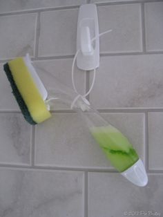 an image of a toothbrush and soap being used to clean the bathroom tile wall