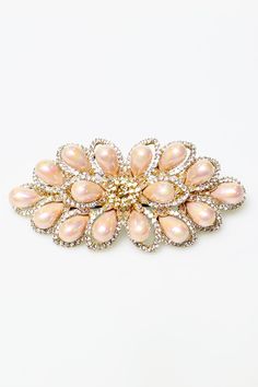 Adorn any hairstyle with this elegant hair clip. Finished with subtle, faux pearls and faux crystals with clasp closure, this piece makes a dazzling yet modern impact for the day, or for the evening. Elegant Clip-on Pearl Earrings For Formal Occasions, Luxury Statement Clip-on Earrings With Pearl Drop, Luxury Pearl Clip-on Earrings Elegant Style, Elegant Pearl Clip-on Jewelry, Luxury Statement Pearl Drop Clip-on Earrings, Crystal Hair Clip, Faux Fur Bag, Crystal Hair Clips, Fur Headband