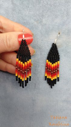 These handmade earrings are made of high-quality Czech beads and strong synthetic thread. They are elegant, fashionable, and highly versatile, suitable for everyday wear. There may be some color discrepancies which is due to the different monitor settings 100% hand made with love! Measurements: Length-about  7cm (2.8 inch) Width -about 1. 8 cm (0.7 inch) Materials: Sterling silver components Czech glass beads Strong bead weaving thread Black Beaded Dangle Tassel Earrings As Gift, Dangle Tassel Earrings With Black Beads For Gift, Black Tassel Earrings With Ear Wire As A Gift, Black Tassel Earrings With Dangling Beads As Gift, Gift Tassel Earrings With Black Beads In Dangle Style, Black Beaded Earrings With Tassels, Black Beaded Tassel Earrings With Round Beads, Black Tassel Drop Earrings With Colorful Beads, Black Tassel Earrings With Colorful Beads For Gift