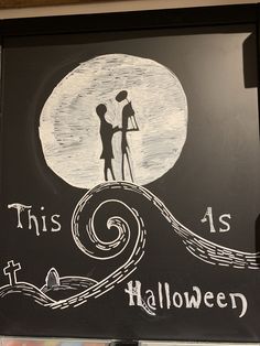 this is an image of a chalkboard with the words halloween written on it and two people holding hands