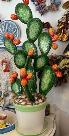 a potted cactus is sitting on a table