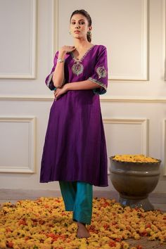 Purple kurta featuring zari hand embroidered neckline and sleeves. Paired with a teal salwar. - Aza Fashions Purple Kurta Woman, Eid Cotton Silk Kurta With Embroidered Neckline, Navratri Tussar Silk Kurta With Dori Work, Festive Embroidered Straight Kurta, Elegant Festive Palazzo Set With Embroidered Neckline, Slub Silk Straight Kurta With Embroidered Border, Designer Cotton Silk Churidar With Embroidered Border, Anarkali Kurta With Embroidered Border In Raw Silk, Purple Raw Silk Kurta With Resham Embroidery