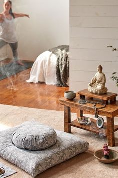 a woman is doing yoga in her living room