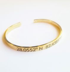 Keep your special location close with this personalized geographic coordinates bracelet! Perfect for remembering a meaningful place. The adjustable cuff bracelet is crafted from your choice of rose gold, silver, or gold plated The latitude and longitude of your chosen location will be engraved onto the bracelet along with an optional custom text like a city name or date. Search the coordinates online, use latitude longitude finder to locate the exact spot you want immortalized. Whether it's the Adjustable Bangle With Engraving Option, Minimalist Adjustable Jewelry With Engraved Text, Minimalist Engraved Adjustable Cuff Bracelet, Adjustable Cuff Bracelet With Engraving Option, Adjustable Engraving Option Cuff Bracelet, Minimalist Stamped Adjustable Cuff Bracelet, Adjustable Stamped Minimalist Cuff Bracelet, Latitude And Longitude, Coordinates Bracelet