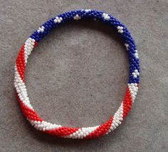 US Flag Bangle Bracelet Fun to ware for the 4th of July.  Red, White, and Blue  Miyuki Seed beads. Handmade Patriotic Blue Bracelet, Handmade Red Bracelet For 4th Of July, Us Flags, Us Flag, Red White And Blue, Bangle Bracelet, Seed Beads, 4th Of July, Bangle Bracelets