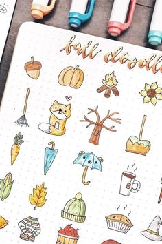 an open notebook with colorful stickers and writing on the cover that says fall around