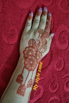 henna tattoo on the palm of a woman's hand