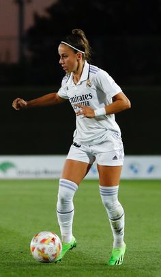 a female soccer player in action on the field