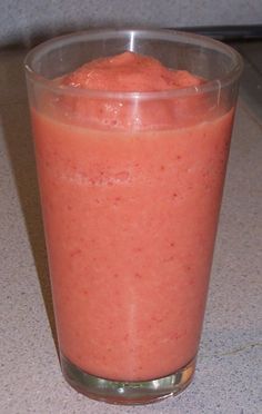 a smoothie in a plastic cup on a counter