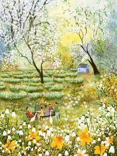 two people sitting at a table in the middle of a field with flowers and trees