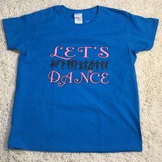 a blue shirt that says let's dance on it