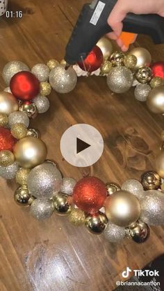 a video demonstrating how to make a christmas ornament wreath