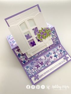 a close up of a greeting card with flowers on the front and back of it