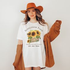 This sunflower shirt would be the perfect gift for any garden lover or flower lover in your life. This womens fall shirt also gives off a farmers market vibe. Favorite this flower shirt to be notified of sales!  ☆ Details ☆ - Light fabric - Retail fit - Tear away label - Runs true to size ☆ Sizing ☆ Please keep in mind, that these are unisex t-shirts. I recommend comparing these sizes to a shirt you already own. That ensures you are ordering the correct size. T-shirts are Bella + Canvas Brand for reference.   ☆ Care Instructions ☆ Wash with like colors, tumble dry on low.  ☆ Processing Time ☆ Please allow 3-5 business days for processing before the item ships. Each shirt is made on a purchase by purchase basis. ☆ Since all items are made to order, we cannot accept returns or exchanges.  ☆ Sunflower Tshirt, Garden Shirt, Fall Shirts Women, Pumpkin Pies, Nashville Outfits, Sunflower Shirt, Honky Tonk, Gardening Shirts, Western Aesthetic