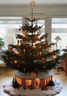 a small christmas tree in the middle of a house