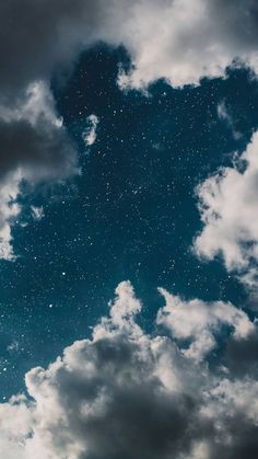 the sky is filled with stars and clouds