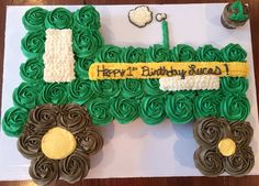 a birthday cake made to look like a tractor with green icing and chocolate curls