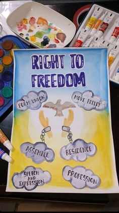 a poster with the words right to freedom written on it next to paints and watercolors