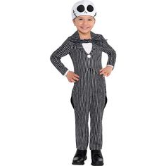 a little boy wearing a costume that is black and white