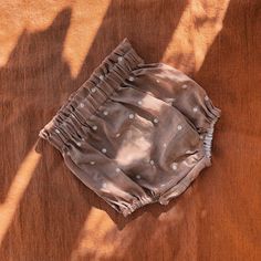 a cloth diaper sitting on top of a wooden table