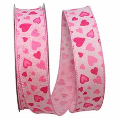 pink hearts grosch ribbon with silver tips on a white background, one side is rolled up and the other half has been sewned off