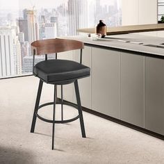 a modern kitchen with an island and bar stools