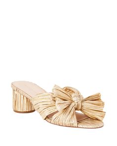 Pleated mid-heel sandal in gold fabric topped with our signature knotted bow. Features a padded footbed with gold stamped logo. Open toe, slips on. 2 inch heel. HEEL HEIGHT 2 in. FIT Emilia runs slightly narrow. For average width feet, we recommend sizing up a 1/2 size. For wider feet, we recommend sizing up 1 size. Elegant Formal Gowns, Mid Heel Sandals, Clog Heels, Bow Heels, Buy List, Gold Fabric, Loeffler Randall, Jewelry Card, Denim Shoes