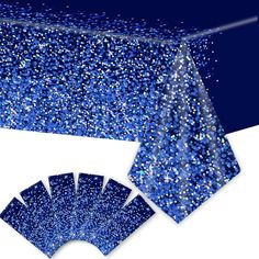 a blue table cloth with glitter on it