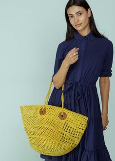 Sans arcidet's arlette bag is an openwork basket bag and features hand sewn raffia braids and a reinforced synthetic leather handle.    measures approximately 19.5" x 11.5" x 10.5".    color citron. 100% raffia. handle 88% polyurethane 8% polyester 2% cotton 2% leather. made in madagascar. Summer Woven Leather Bag With Round Handle, Summer Straw Bag With Woven Leather And Round Handle, Basket-shaped Crochet Shopping Bag, Yellow Top Handle Straw Bag For Shopping, Yellow Beach Bag With Braided Handles For Shopping, Yellow Crochet Bag With Braided Handles For Shopping, Straw Bag With Braided Handles For Shopping, Open Weave Shopping Bag, Yellow Woven Top Handle Shoulder Bag