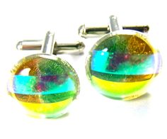 Cuff Links DICHROIC Fused GLASS Green Gold Amber Round Striped Mens Formal Wear DICHROIC Fused GLASS Round Cuff Links Lime Green Golden Amber with Teal & Peach Stripes Men's Formal Wear .... 5/8", 20mm nuggets. This type of glass transmits light in one wavelength, & reflects light in two other wavelengths. It is common for dichroic glass to appear as 2 or 3 different colors, simultaneously. Dichroic glass is coated with electronically excited metallic particles in a vacuum chamber, at elevated temperatures. In our studio, we start with large sheets of glass which we cut into small pieces. These pieces are specially arranged & melted together in a kiln to form our jewelry. These cuff links have been handcrafted at Dicro City USA. FL, USA. -------------------------- DISCOUNTS FOR VOLUME SHOP Golden Amber, Mens Formal Wear, Mens Formal, Dichroic Glass, Cuff Links, Green Gold, Fused Glass, Formal Wear, Kiln