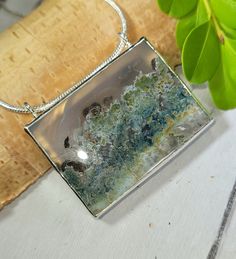 "Natural AAA Grade Scenic Moss Agate Rectangle Handmade .925 Sterling Silver Pendant 1 5/8\" x 1 3/8\" 21.3 Grams FG25 Gift for Her Genuine Stone.  Slider bails will accommodate up to 3mm chain. Looks even better in person and is extremely well made! This is a handpicked natural stone, the exact one shown in picture.  The sterling silver is .925 and stamped.  Each piece is handmade by artisans in my shop.  The quality of the stones and the silver workmanship is impressive.  Please look at other items in my store.  I sell ready made jewelry with hand crafted silver work, pendants with a sterling silver bails and beautiful unique stones for jewelry wire wrapping and weaving. You will pay exact amount on shipping plus $1 for supplies and labor. All items are shipped within a couple of days af Unique Rectangular Gemstone Necklace, Silver Work, Statement Pendant, Agate Pendant, Moss Agate, Wire Wrapped Jewelry, Sterling Silver Pendant, Wire Jewelry, Sterling Silver Pendants