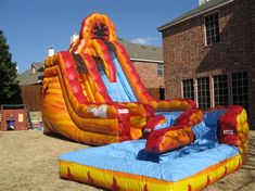 an inflatable water slide is on the lawn