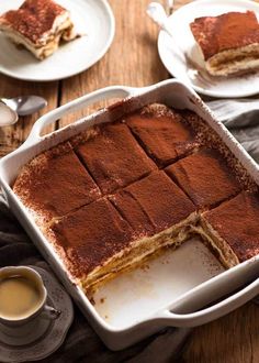 a pan filled with dessert sitting on top of a wooden table