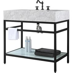 a white sink sitting under a faucet on top of a wooden shelf next to a towel rack