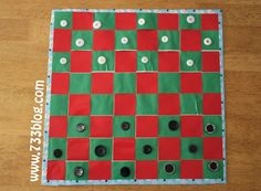 a close up of a board game on a wooden table with buttons and plastic wrap