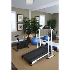 there is a gym with exercise equipment in the room