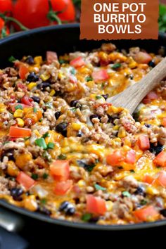 one pot burrito bowls with tomatoes, black beans, corn and cheese in a cast iron skillet