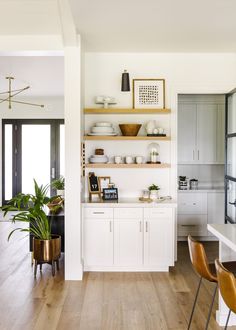 the kitchen is clean and ready to be used as a dining room or living room