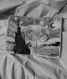 an open notebook with a drawing on it