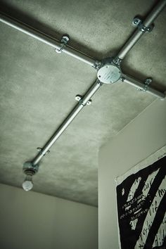 an overhead light fixture in the corner of a room