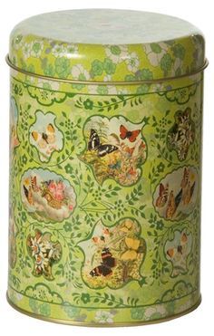 a green tin with pictures of animals on the lid and flowers in the pattern around it