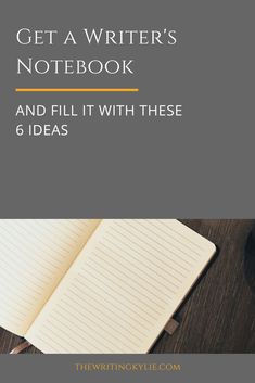 an open notebook sitting on top of a wooden desk