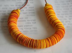 "Orange statement necklace - this orange paper bead statement necklace is outstanding! This bold and colorful chunky bead necklaces a unique handmade piece of recycled jewelry every woman would enjoy wearing.  This lightweight paper bead necklace is handmade of hundreds of circular orange paper disc beads finished with wood beads. It is a long bold & joyful necklace, and the fact that it is hand-made of recycled paper beads gives it that extra meaningful glamour. All my jewelry is 100% handmade. Tube Jewelry, Orange Statement Necklace, Paper Beads Necklace, Necklace Inspiration, Bead Making, Thread Necklace, Chunky Bead Necklaces, Orange Necklace, Colorful Necklace