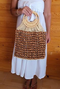 Hello dear welcome to my store. My bag are 100% handmade. These specially designed bag each of which is handmade. It is knitted from luxurious wood beads. Material : Wood beads, macrame, straw rope Measurements :  H 52 cm W 37 cm Gift for Women, Wood Beads Bag, Macrame Bag Natural Rectangular Bag With Wooden Beads, Rectangular Natural Bag With Wooden Beads, Natural Beaded Bag As Gift, Natural Beaded Bag Perfect For Gifts, Natural Beaded Bags Perfect For Gifts, Brown Bag With Wooden Beads For Everyday Use, Natural Beaded Shoulder Bag For Daily Use, Everyday Beaded Crochet Tote Bag, Bohemian Beaded Crochet Bag In Natural Color