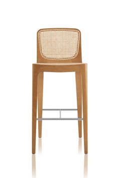 a wooden chair with wicker back and seat