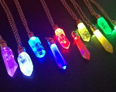 six necklaces with different colored lights on them