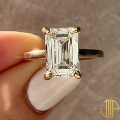 5 CT Emerald Cut Solitaire Engagement Ring Emerald Cut Engagement Ring Emerald Cut Ring Hidden Halo 14k Solid Moissanite Engagement Ring ⦿ 𝐃𝐞𝐬𝐢𝐠𝐧 𝐍𝐨 : JPR209 ⦿ 𝐑𝐢𝐧𝐠 𝐃𝐞𝐭𝐚𝐢𝐥𝐬 * Main Stone Shape : Emerald Cut * Main Stone Carat Weight : 5 carat Approx. * Main Stone MM Size : 12X9MM * Stone Type: Moissanite  * Stone Color: D Color * Stone Clarity: VVS1 * Custom color: Solid Rose Gold, Solid Yellow Gold, and Solid White Gold. * All silver or gold pieces are stamped with the metal type on the inside. Feel free to contact me with any questions or requests. ⦿ 𝐑𝐢𝐧𝐠 𝐒𝐢𝐳𝐞 → A larger Ring size is available, please feel free to contact me if you need another ring size. ⦿ 𝐄𝐧𝐠𝐫𝐚𝐯𝐢𝐧𝐠 → We provide free engraving of up to 5 fonts. ⦿ 𝗩𝗶𝘀𝗶𝘁 𝗺𝘆 𝘀𝗵𝗼𝗽 𝗳𝗼𝗿 𝗺𝗼𝗿? Solitaire Engagement Ring Emerald, Moissanite Engagement Ring Emerald, Emerald Cut Solitaire Engagement Ring, Engagement Ring Emerald Cut, Emerald Cut Solitaire, Emerald Cut Engagement Ring, Emerald Cut Ring, Engagement Ring Emerald, Ring Hidden Halo