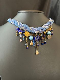 This Ethnic Choker Collar is a unique piece that blends bohemian charm with a modern twist. Handcrafted with intricate macrame work, this Boho Crochet Necklace features elegant blue and gold details, making it a standout accessory. Perfect for those who appreciate Y2K Jewelry, this one of a kind necklace is an excellent choice for a 21st Birthday Gift, ensuring a memorable and stylish celebration. Length: 38 cm (approximately 15 inches) This distinctive necklace will complement any outfit, addin Blue Bohemian Necklaces For Party, Bohemian Style Jewelry With Unique Variations For Party, Bohemian Adjustable Beaded Necklaces For Celebration, Bohemian Party Jewelry With Unique Variations, Bohemian Style Party Jewelry With Unique Variations, Eclectic Handmade Beaded Necklaces For Festivals, Handmade Adjustable Necklace For Festivals, Blue Hippie Necklaces For Festivals, Hippie Blue Necklaces For Festivals