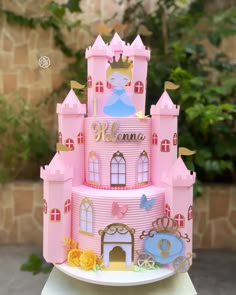 a pink princess castle cake on a table