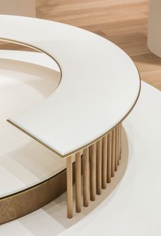 a white table with gold trim around it